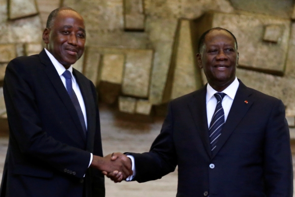 Amadou Gon Coulibaly (left), Alassane Ouattara's (right) heir apparent in 2020's presidential run.