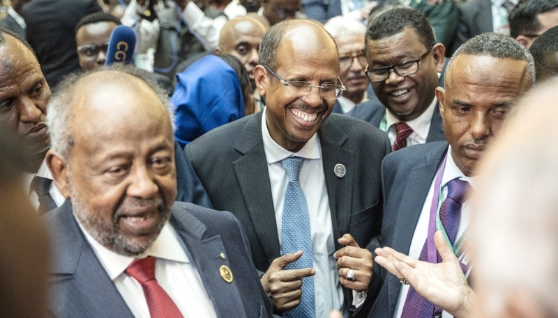 Newly elected chair of the AU Commission Mahmoud Ali Youssouf (centre) and Ismaïl Omar Guelleh (left) at the AU HQ in Addis Ababa, 15 February 2025.