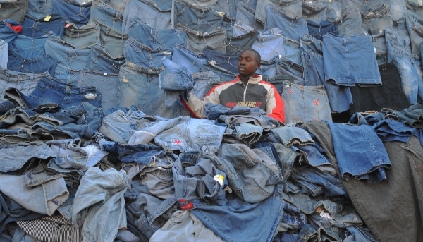 A seller of second-hand clothes, known as 'mitumba', at the market in Gikomba, Nairobi, on 25 June 2012.