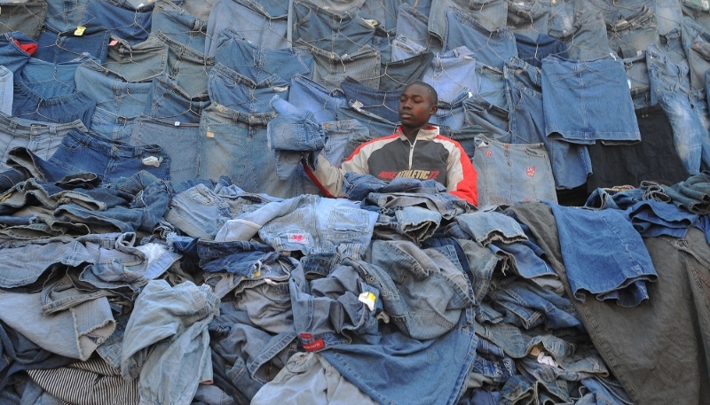 A seller of second-hand clothes, known as 'mitumba', at the market in Gikomba, Nairobi, on 25 June 2012.