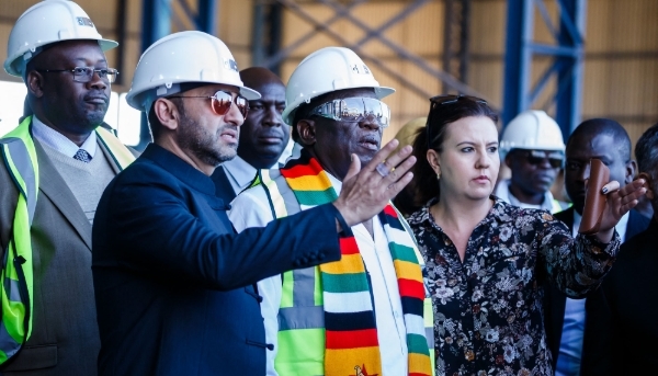 Zunaid Moti (left) and Zimbabwe's President Emmerson Mnangagwa, in Kwekwe, 2018.