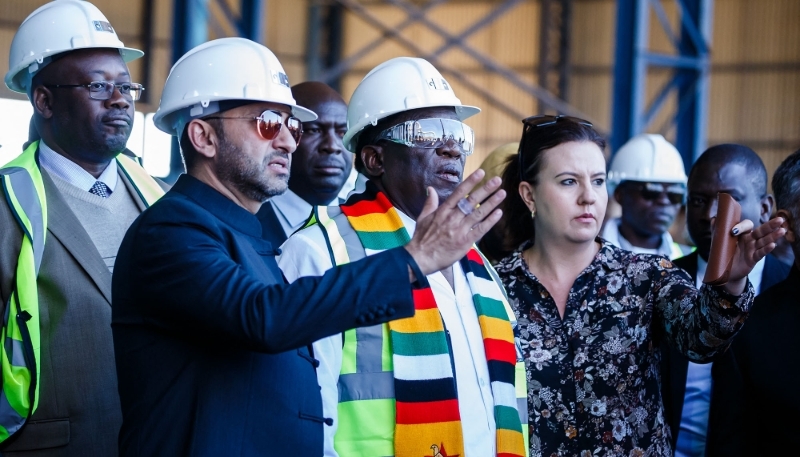 Zunaid Moti (left) and Zimbabwe's President Emmerson Mnangagwa, in Kwekwe, 2018.