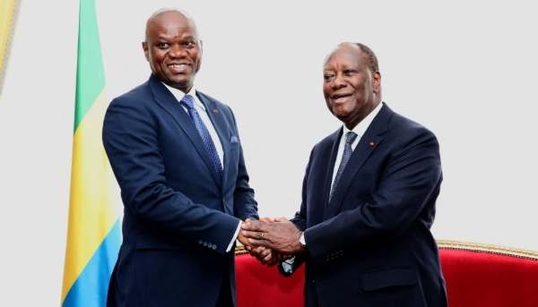 Gabon's then transitional President Brice Clotaire Oligui Nguema (left) with President Alassane Ouattara at Abidjan's presidential palace, Ivory Coast, 12 April 2024.