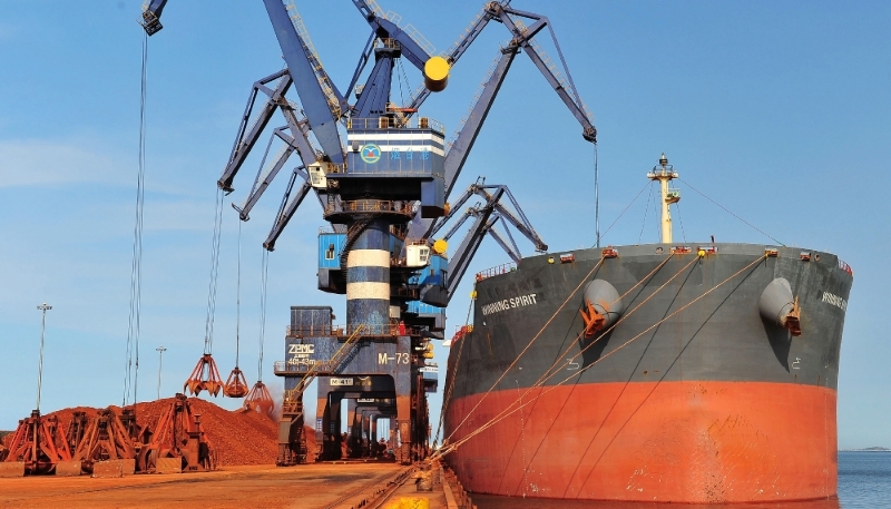 A ship carrying bauxite from Guinea is unloaded at a port in Yantai, China, 2017.