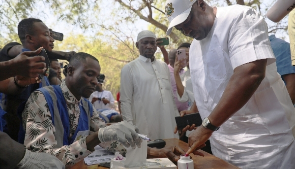 John Dramani Mahama casts his ballot at a polling station in Bole in north-western Ghana on 7 December 2024.