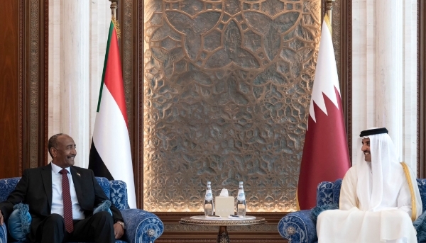 Qatar's Emir Sheikh Tamim bin Hamad al-Thani (R) meeting with Sudan's army chief General Abdel Fattah al-Burhan (L) in Doha, on 7 September, 2023.