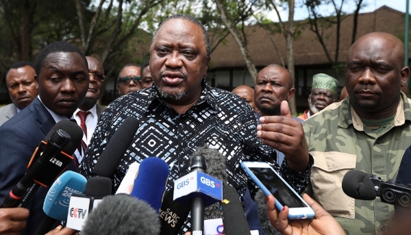 Kenya's former President Uhuru Kenyatta (centre), in Nairobi, 6 December 2022.