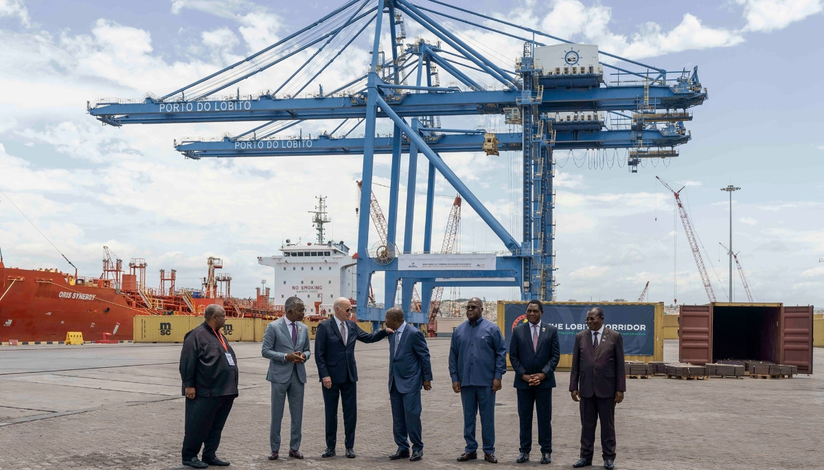 Former US President Joe Biden speaks to Angolan President João Lourenço while touring the Lobito Terminal with African leaders during the Lobito Corridor Trans-Africa Summit, 4 December 2024, in Lobito, Angola.