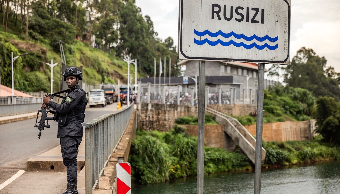 A Rwandan police officer stands guard along the Ruzizi River near Cyangugu, in February 2025.