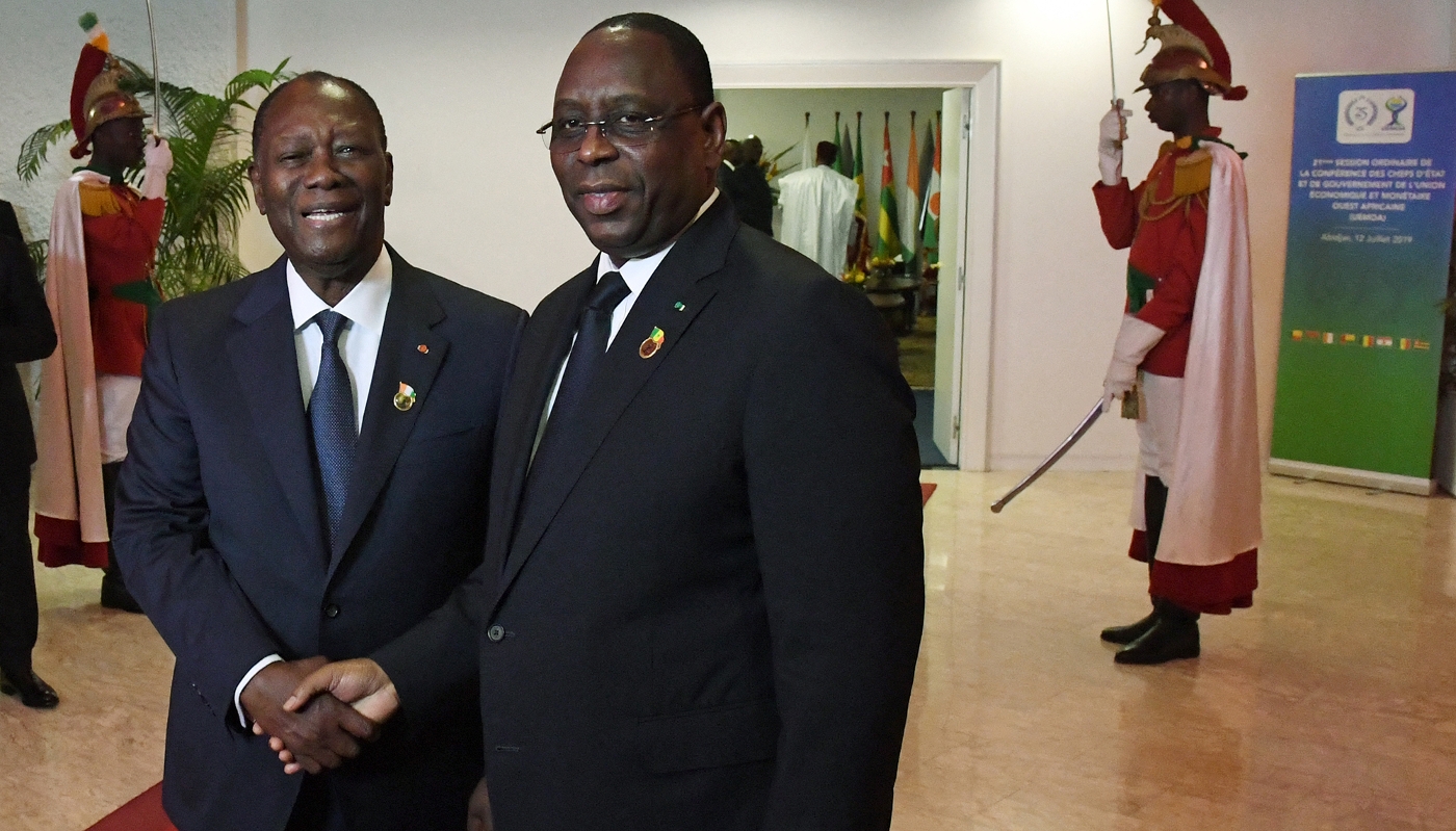 Ivory Coast President Alassane Ouattara (left) with ex-president of Senegal Macky Sall in Abidjan, on 12 July 2019.