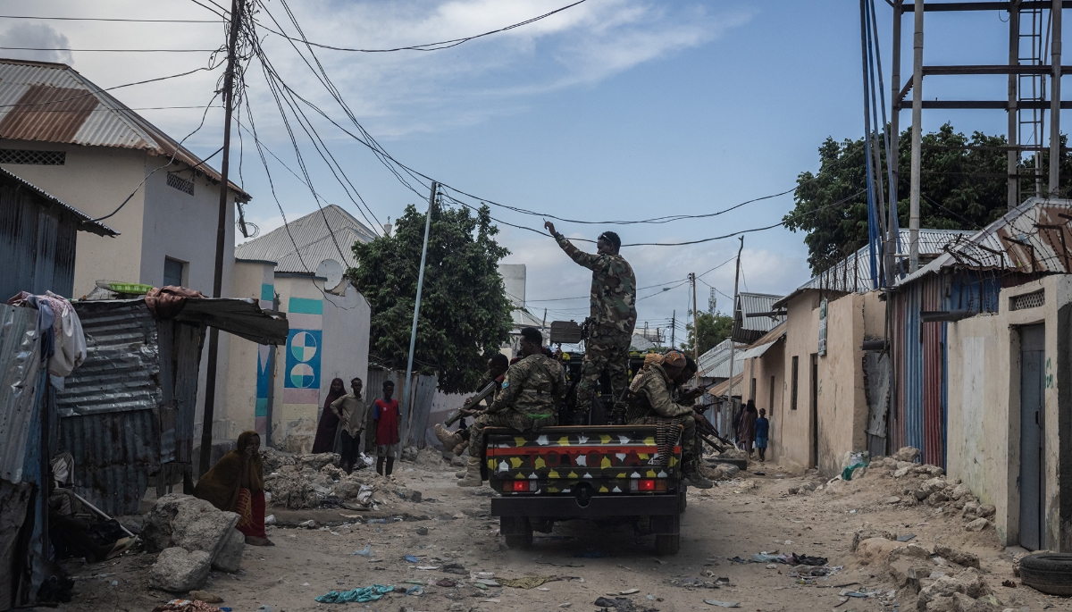 Soldiers from the Somali National Army ride in a convoy as part of a security escort on 21 April 2025 in Mogadishu, Somalia.