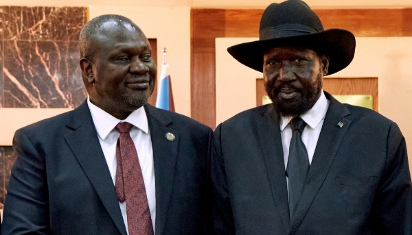 Salva Kiir with former First Vice President Riek Machar at the State House in Juba, on 22 February 2020.