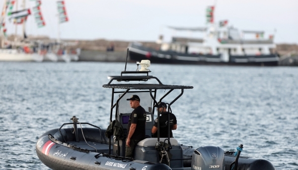 Tunisian coastguards patrol near Global Sumud vessels in the port of Bizerte, Tunisia, on 13 September 2025.