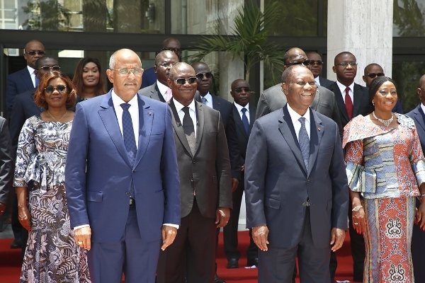Ivorian President Alassane Ouattara (front-R) poses with his new government as well as new Prime Minister Patrick Achi (front-L) in Abidjan, Ivory Coast, 7 April 2021.