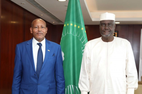 The Chairperson of the African Union Commission Moussa Faki Mahamat (R) and Aleli Admasu, Israel's ambassador to Ethiopia, Burundi and Chad.