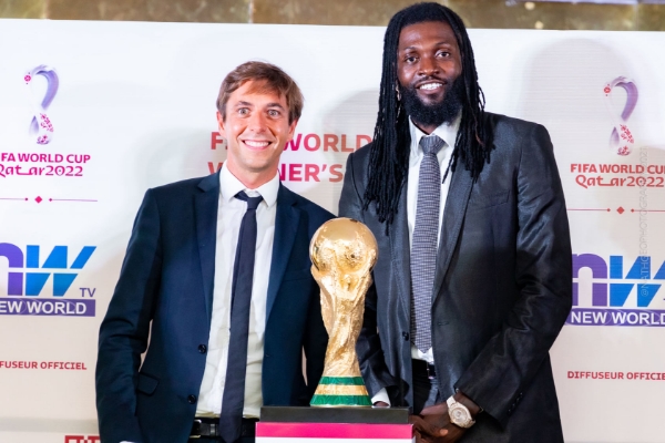 Emmanuel Adebayor with a FIFA representative.