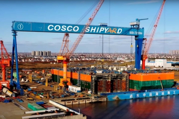 The Cosco shipyard, in China, where BP's floating production storage and offloading platform for the Grand Tortue Ahmeyim field is built (right).