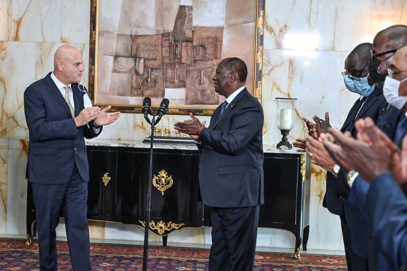 ENI president Claudio Descalzi and Ivorian President Alassane Ouattara address a press conference on 10 December 2021 at the presidential palace in Abidjan.