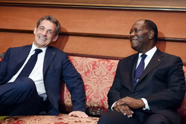 Former French president Nicolas Sarkozy and Ivory Coast's president Alassane Ouattara.