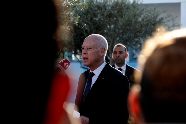 Tunisian President Kais Saied speaks to the media after voting during the 2022 Tunisian parliamentary election.