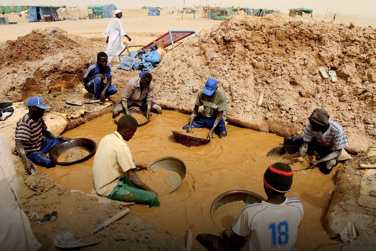 Sudanese men pan for gold at the village of al-Abidiya in northern Sudan in 2010.