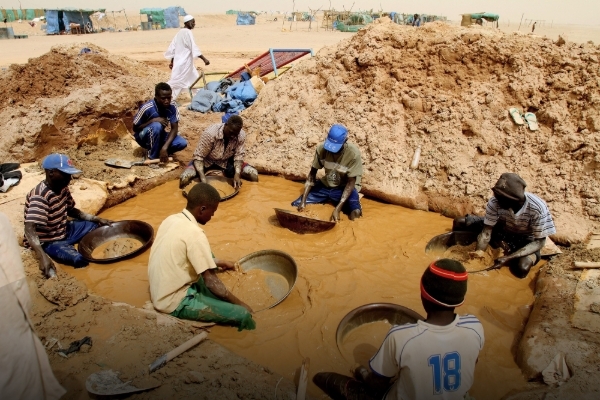 Sudanese men pan for gold at the village of al-Abidiya in northern Sudan in 2010.